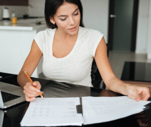 woman reading through progress after working with a life coach or mentor