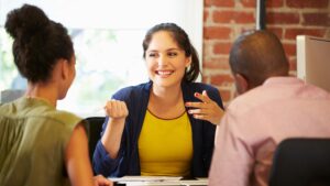 Financial Planner with couple discussing moneny